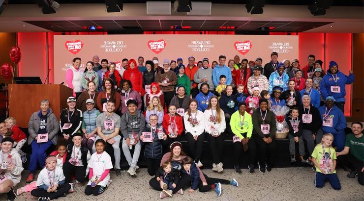 Chocolate 5k runners and walkers celebrate with a group photo.